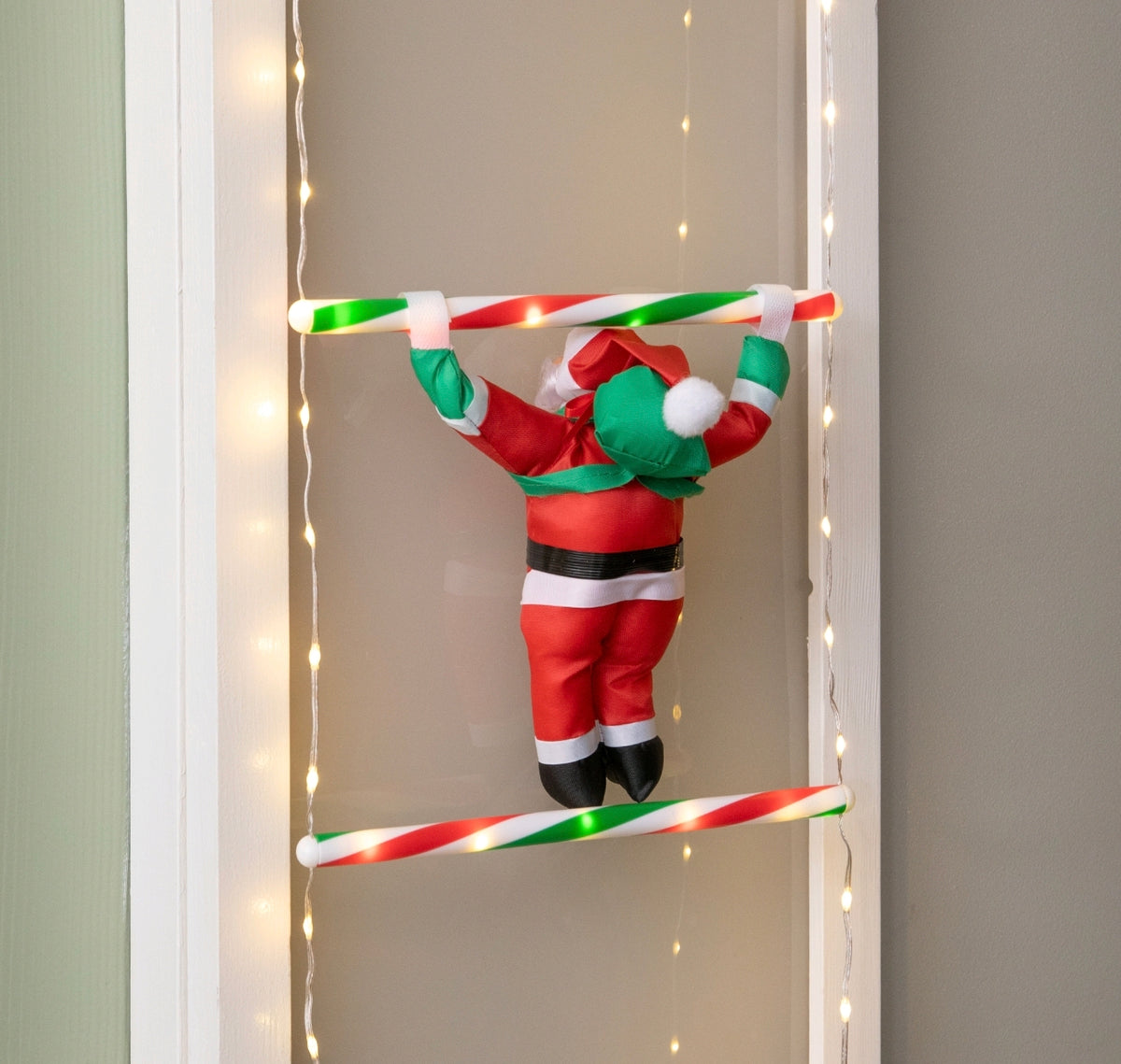 Santa Climbing A Light Up Ladder