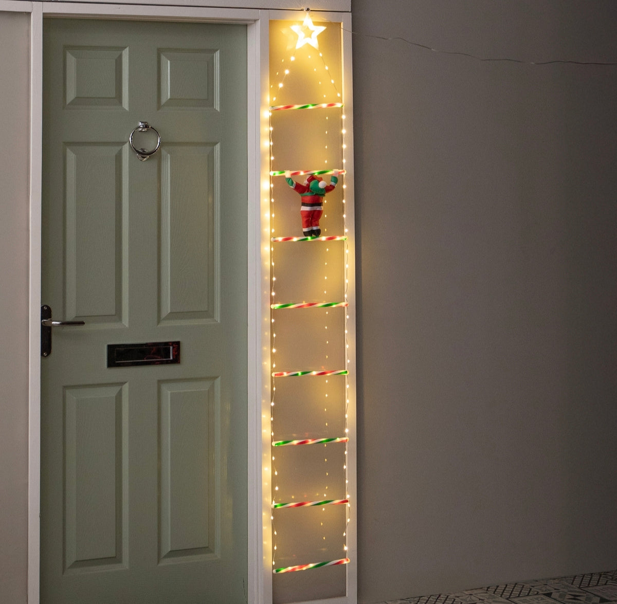Santa Climbing A Light Up Ladder