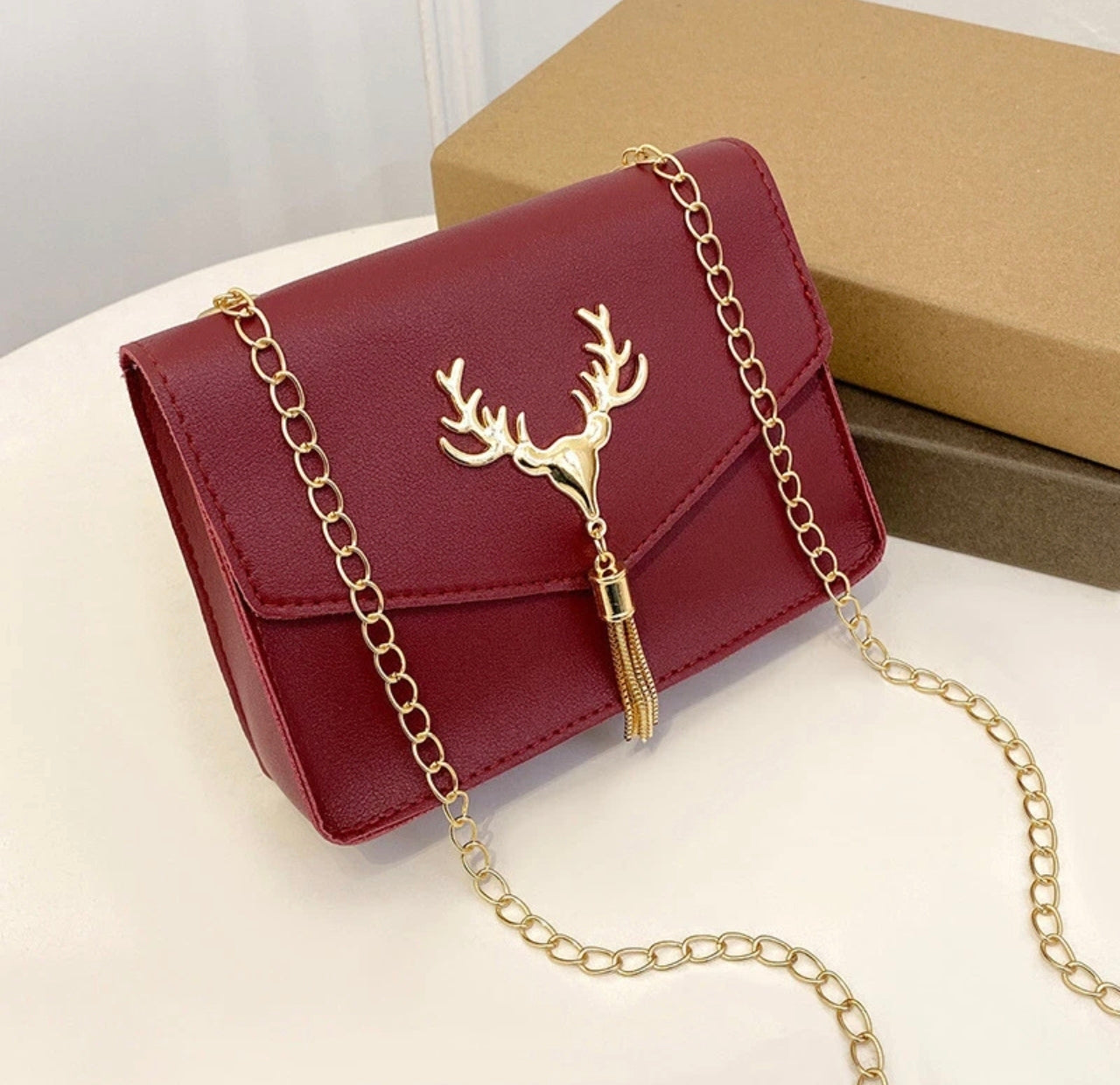 Small Bag With Chain Strap And Stag Embellishment