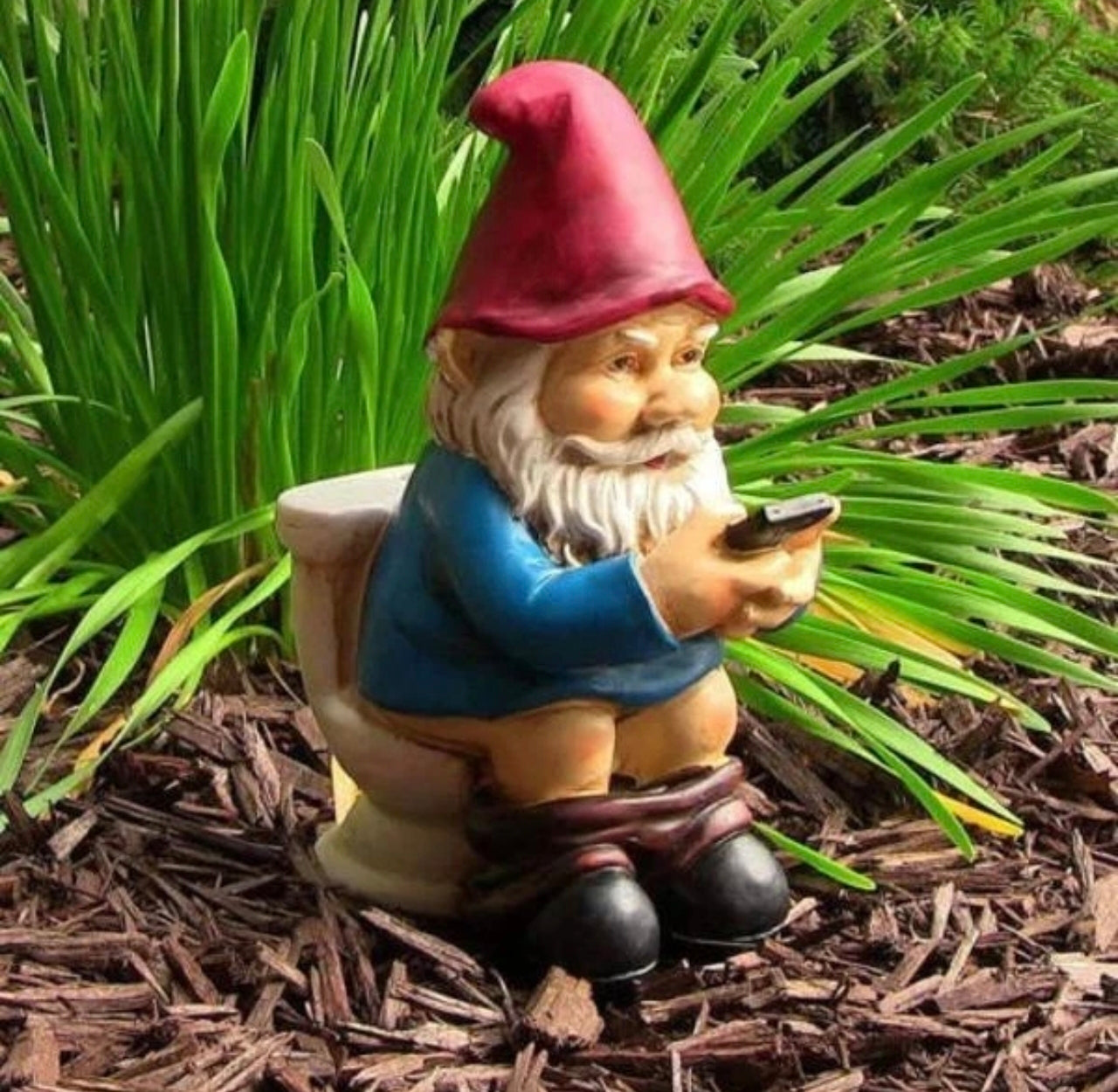Funny Miniature Gnome On The Throne
